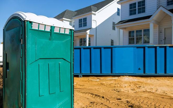 portable toilet and dumpster at a construction site project in Pearland TX